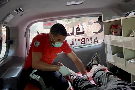 Paramedic applying Glia tourniquet